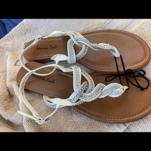 Glitzy silver beaded twisted flat sandals